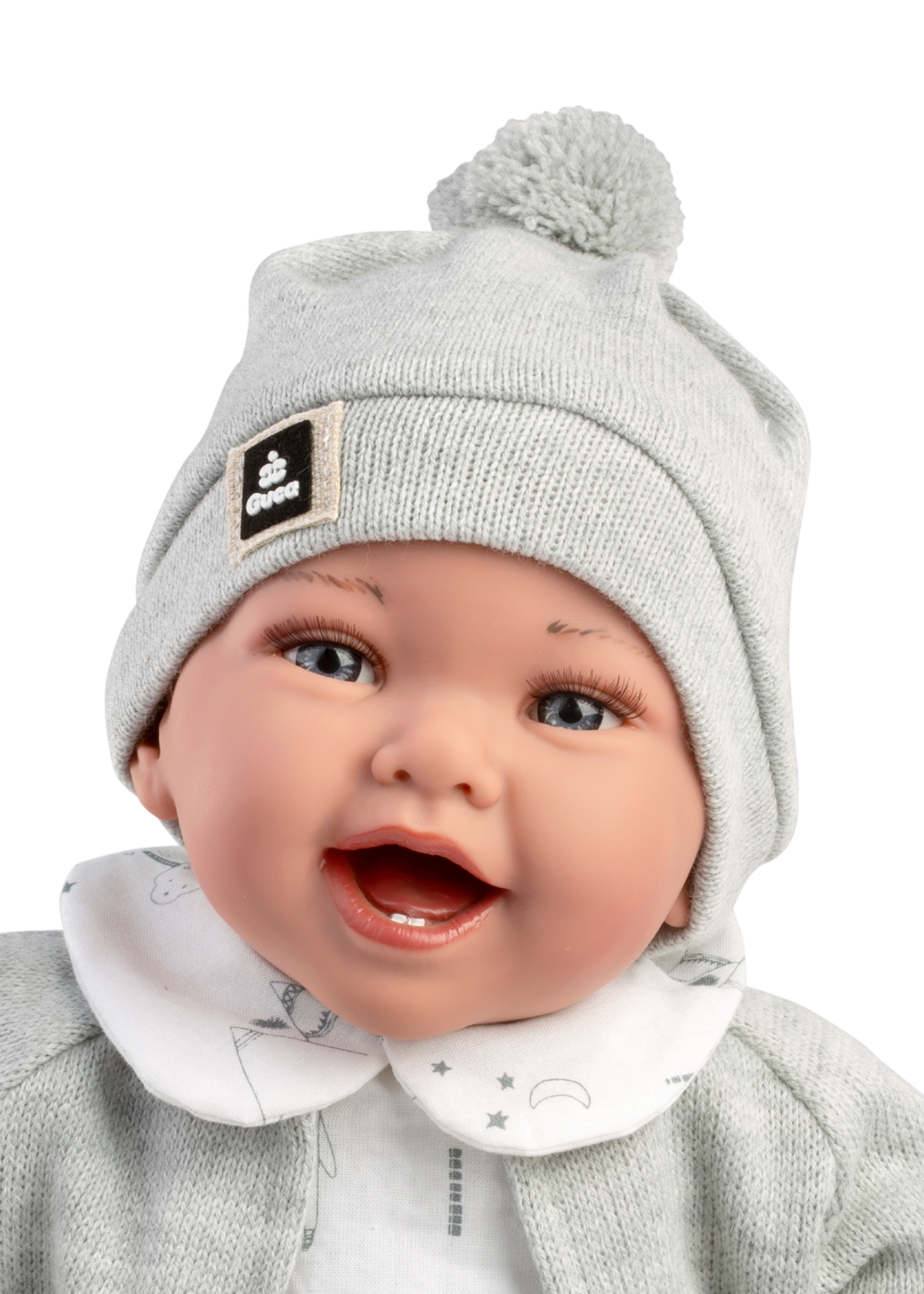 Papusa Zuri, 42 cm Fara Par, Corp Vinil+Textil cu Salopeta Scurta Alb-Gri si Jacheta Tricotat Gri 10300  Guca Munecas